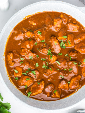 Air Fryer Chicken Vindaloo with tender, spiced chicken served with a flavorful curry sauce and garnished with cilantro.