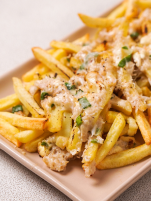 Golden fries topped with gooey melted cheese and chunks of seasoned crab meat, served fresh from the air fryer.