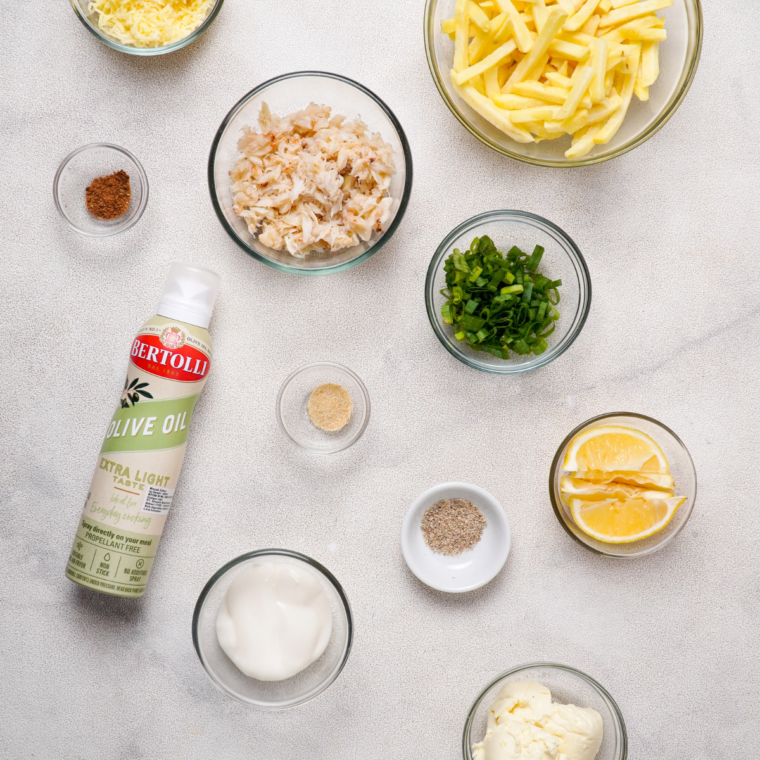 Ingredients needed for Air Fryer Crabby Cheese Fries on kitchen table.