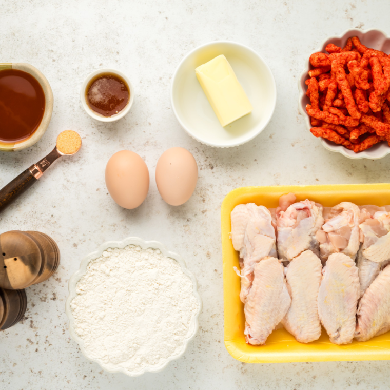 Ingredients needed for Air Fryer Flamin' Hot Cheetos Chicken Wings on table.