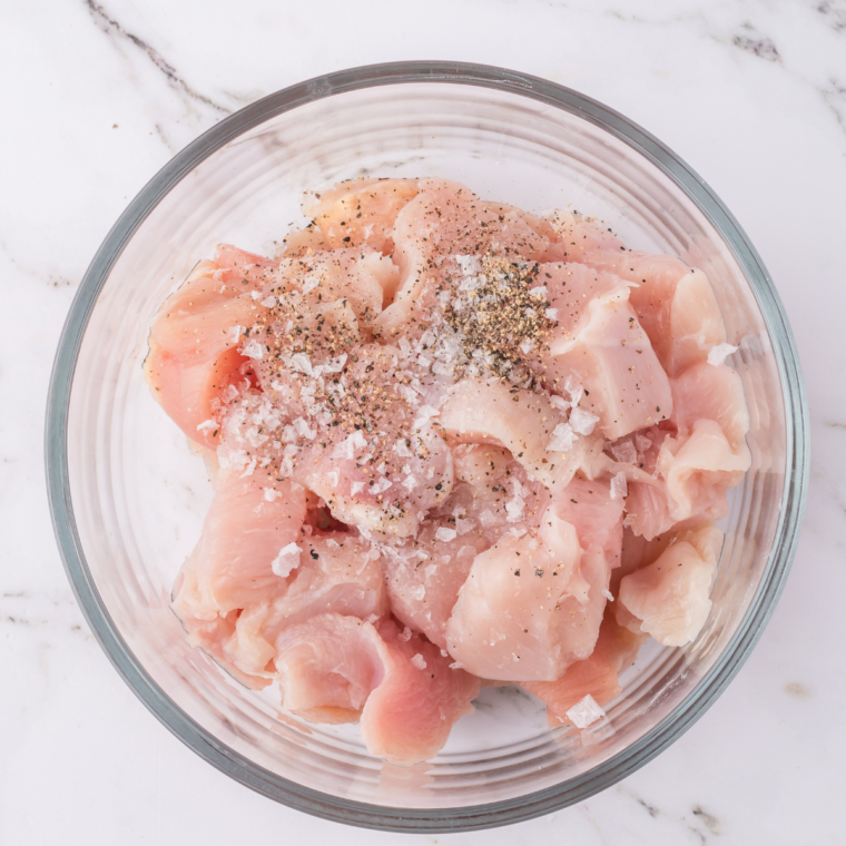 Coat the chicken with seasonings in a large mixing bowl.