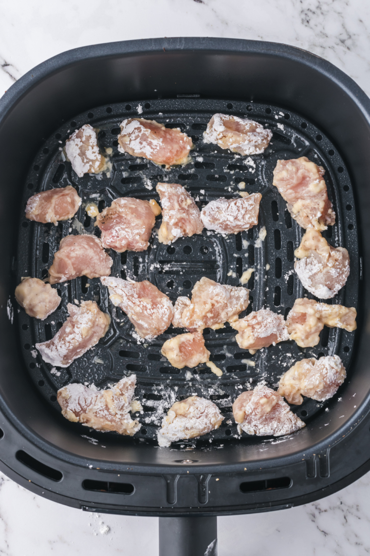 Place coated chicken into the air fryer basket. Single layer, and spread out.