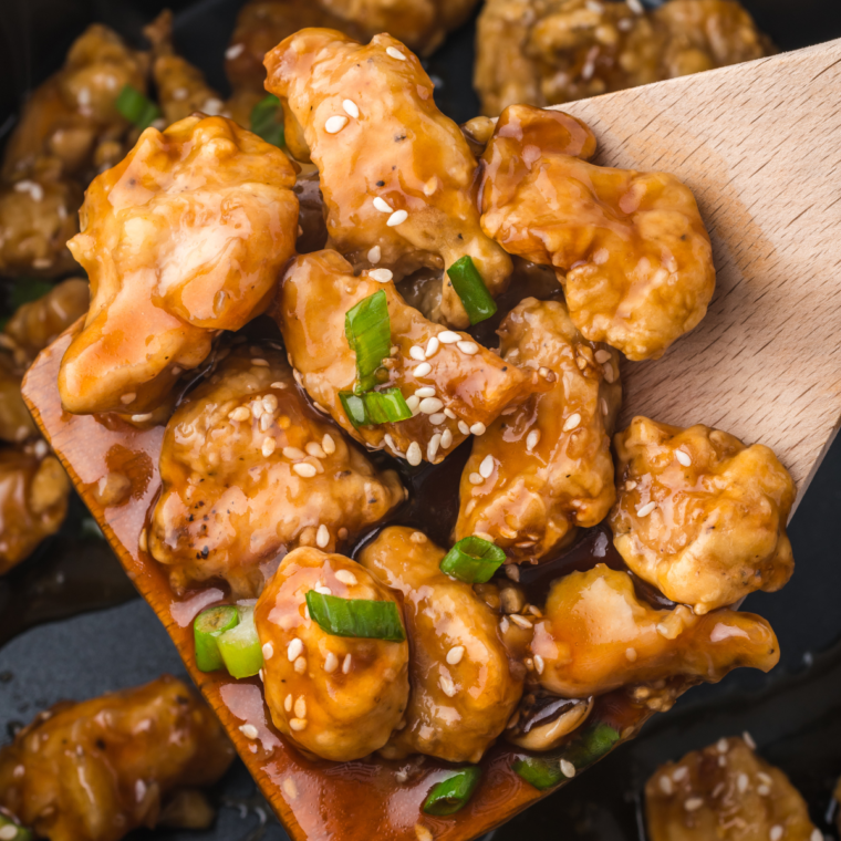 Garnished PF Chang’s Spicy Chicken with sesame seeds and green onions.