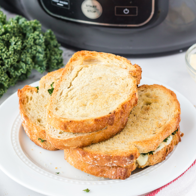 Air Fryer Provolone Broccoli Rabe Sandwich with melted provolone cheese, saut&eacute;ed broccoli rabe, and crispy sourdough bread.