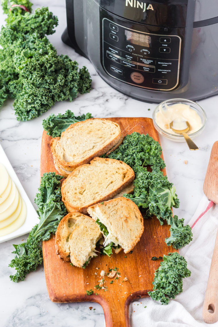 Air Fryer Provolone Broccoli Rabe Sandwich with melted provolone cheese, saut&eacute;ed broccoli rabe, and crispy sourdough bread.