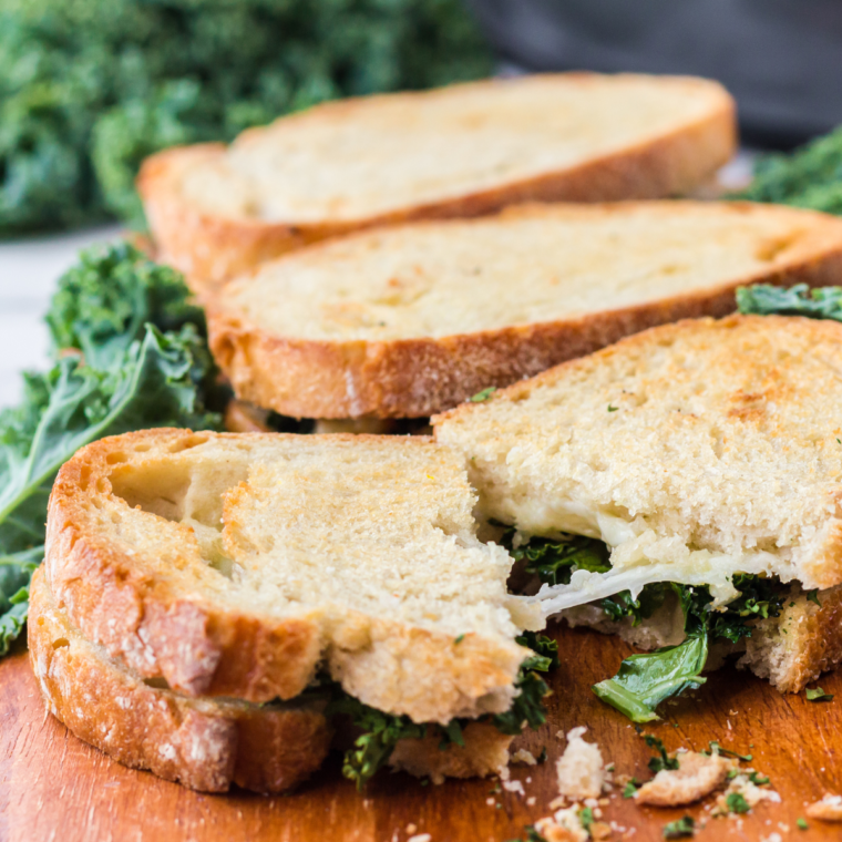 
"Air Fryer Provolone Broccoli Rabe Sandwich with melted provolone cheese, saut&eacute;ed broccoli rabe, and crispy sourdough bread toasted to perfection."