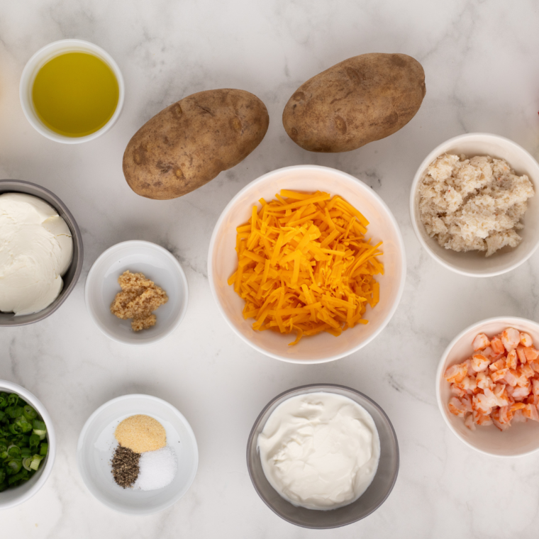 Ingredients needed for Air Fryer Seafood Baked Potato on table.