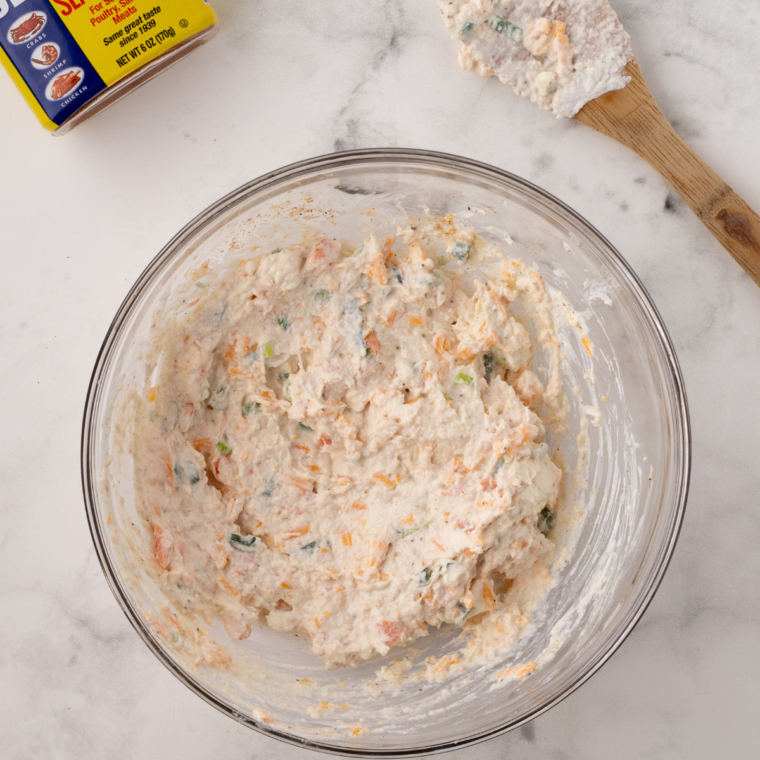 "Seasoned seafood mixture with salt, pepper, and Old Bay seasoning stirred until well combined."