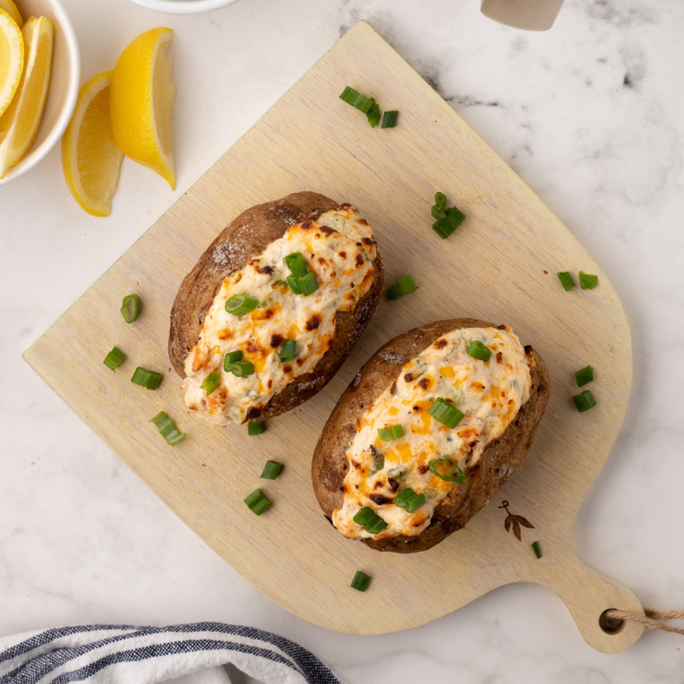 "Delicious Air Fryer Seafood Baked Potato topped with shrimp and crab"