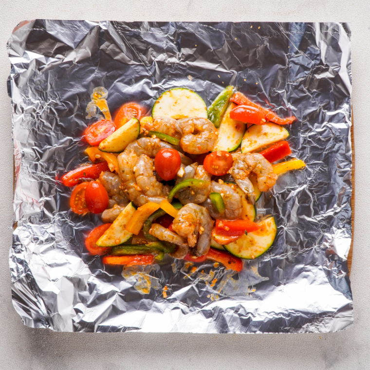 Place shrimp and vegetables on a large piece of foil.