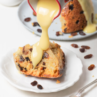 Golden, fluffy Air Fryer Spotted Dick served warm with currants."
