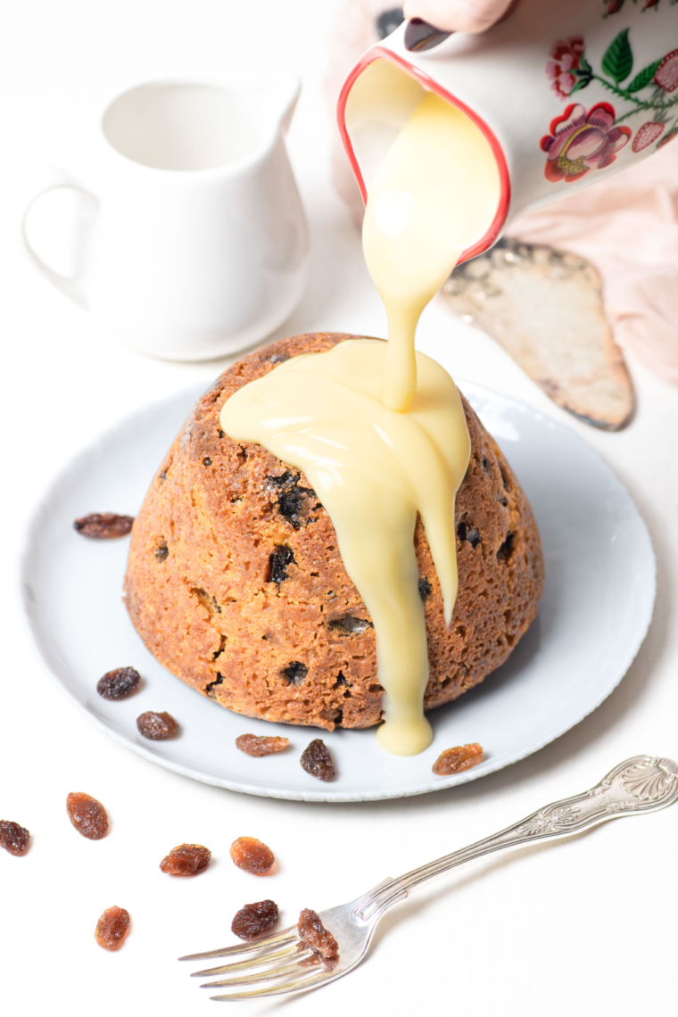 Golden and fluffy Air Fryer Spotted Dick with currants, a classic British dessert served warm.