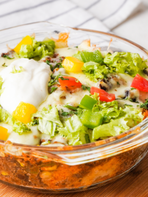 "Air Fryer Taco Fiesta Bubble Up Casserole with golden-brown bubbly biscuit pieces topped with melted cheese and fresh cilantro."