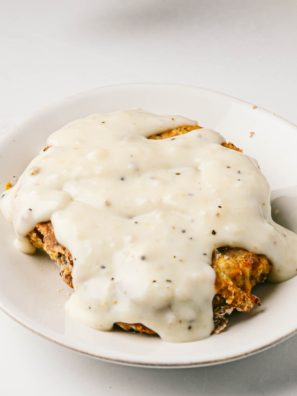 Plate of crispy, golden BEST Copycat Texas Roadhouse Country Fried Chicken, served with sides"