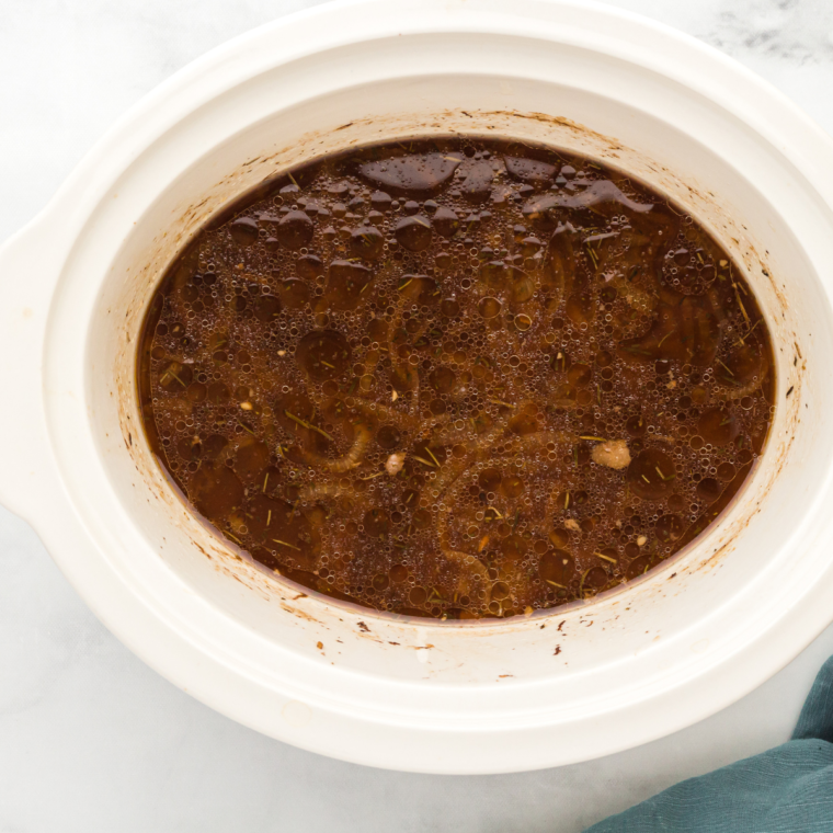 Slow cooker flank steak ingredients in the crock pot