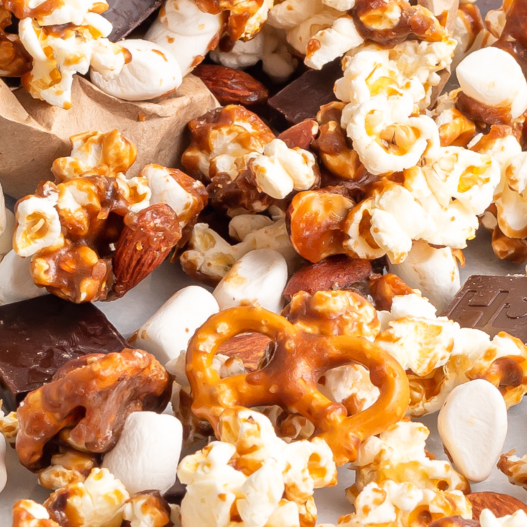 Air Fryer Moose Munch Caramel Popcorn with popcorn, almonds, pretzels, and mini marshmallows, drizzled with homemade caramel and air fried to perfection.