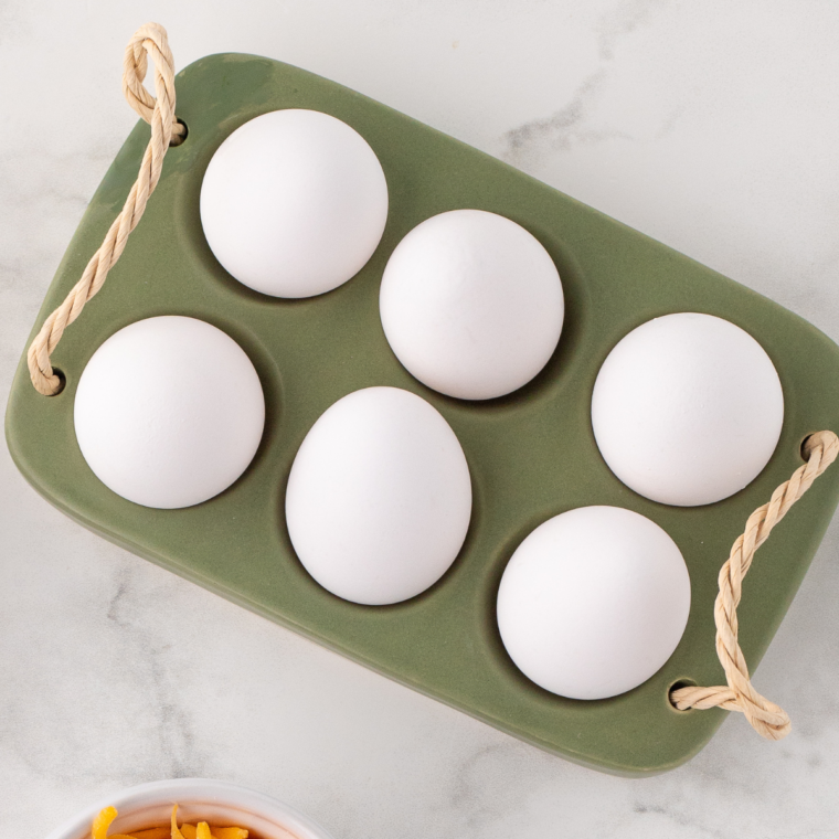 Ingredients needed for Black Garlic Deviled Eggs on table.