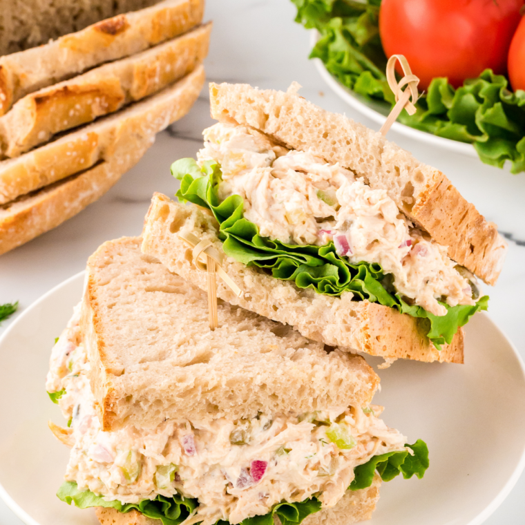 Fresh and vibrant Cape Cod Chicken Salad with grilled chicken, mixed greens, sliced apples, red onion, dried cranberries, and chopped walnuts, topped with a tangy dressing.