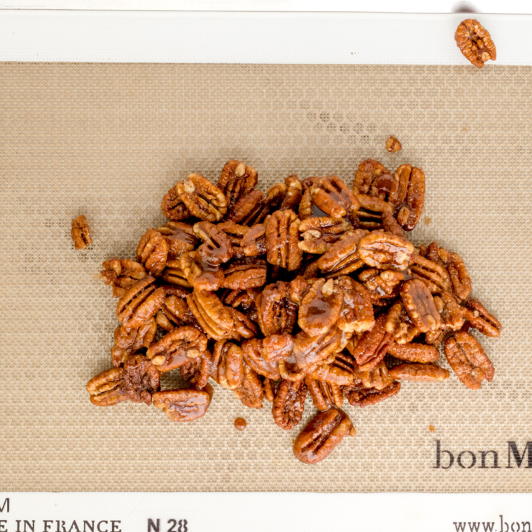  A bowl of homemade Copycat Buc-ee’s Pecans with a sweet and savory glaze, perfect for snacking.