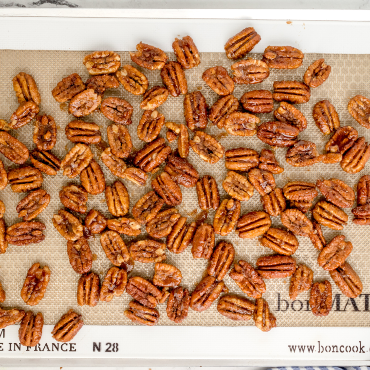 Spread pecans onto a baking sheet.