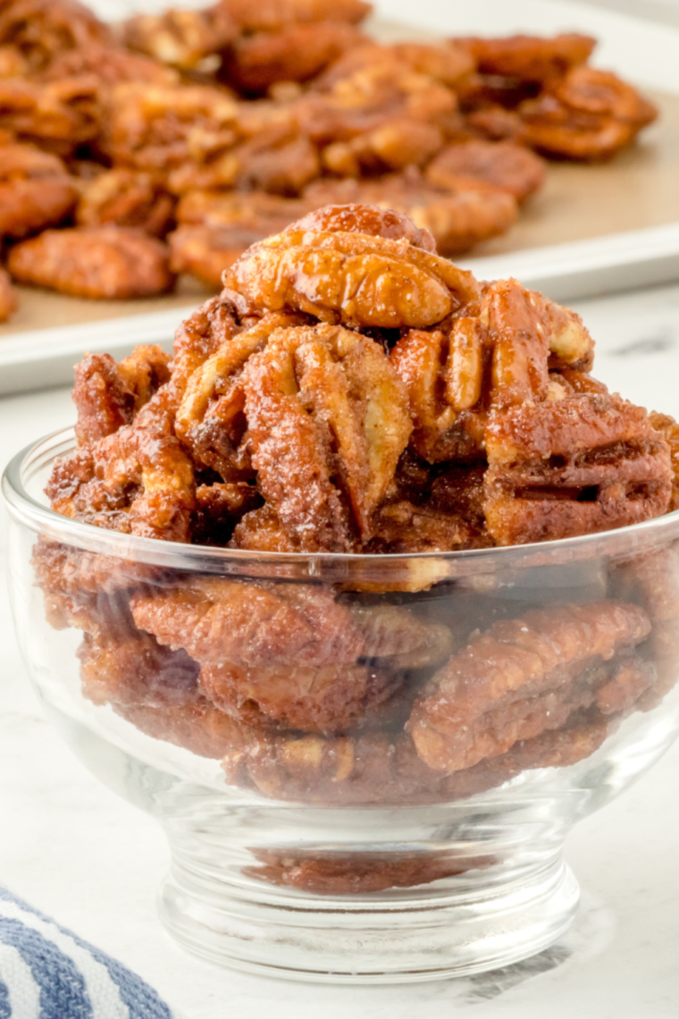  bowl of homemade Copycat Buc-ee’s Pecans, golden and crispy with a cinnamon-sugar coating.