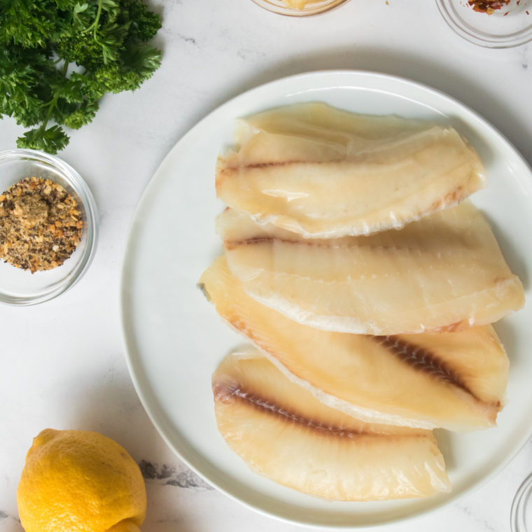 Ingredients needed for Copycat Olive Garden Parmesan Crusted Tilapia Recipe on counter.