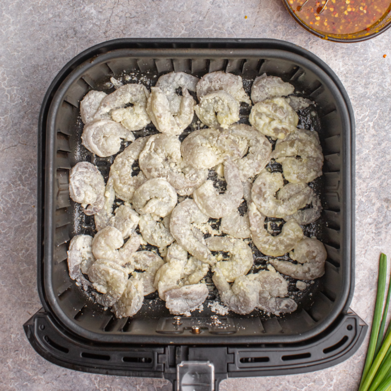 Place coated shrimp into the air fryer basket, in a single layer.