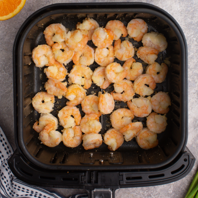 Cooked Dynamite Shrimp Recipe in air fryer basket.