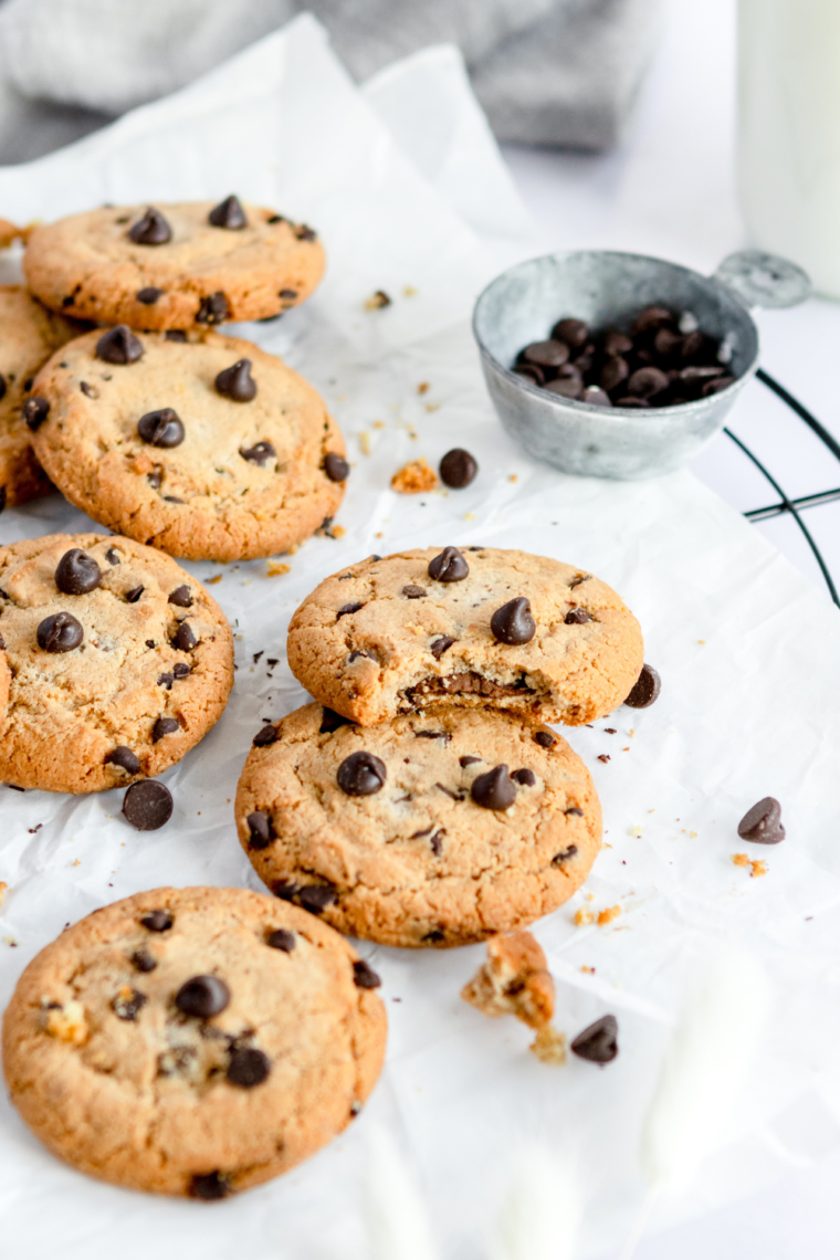 Baking tray with freshly made Copycat Potbelly Oatmeal Chocolate Chip Cookies, golden brown and loaded with oats and chocolate chips.