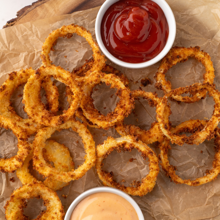 Crispy, golden brown Copycat Sonic Onion Rings served with a dipping sauce.