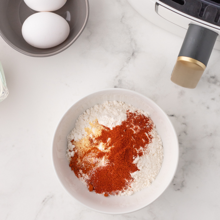 Prepare the seasoning blend in a large mixing bowl.