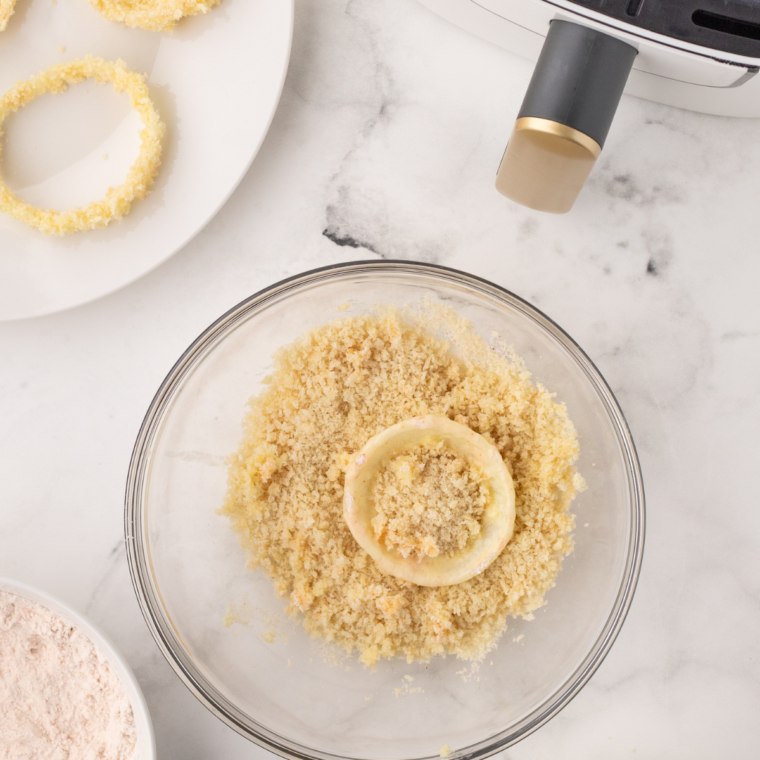  "Dip each onion ring into the batter, ensuring it’s fully coated, then roll it in breadcrumbs for a crispy coating."