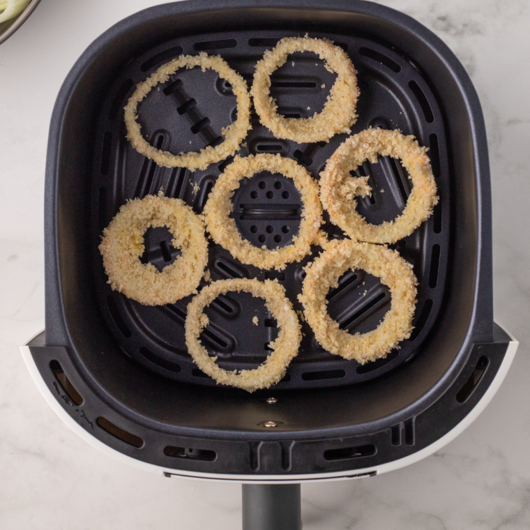 Golden crispy Copycat Sonic onion rings, coated with a light batter and breadcrumbs, ready to serve."