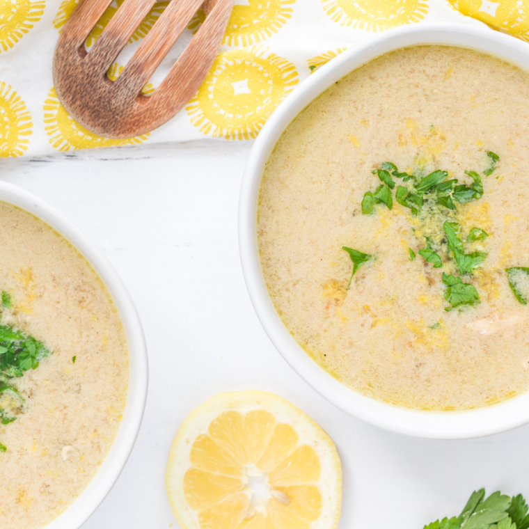 Bowl of Demo’s Chicken and Rice Soup with chicken, rice, vegetables, and fresh parsley