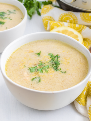 "Bowl of Demo’s Chicken and Rice Soup, filled with chicken, rice, and vegetables, ready to serve"