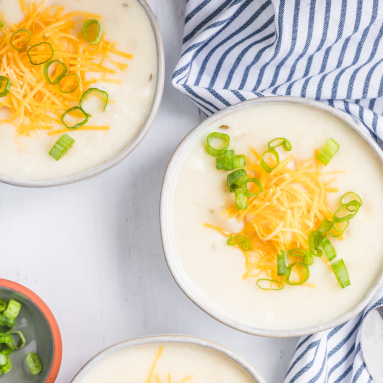 "Eat N Park Potato Soup served in a bowl, topped with cheddar cheese and chives."