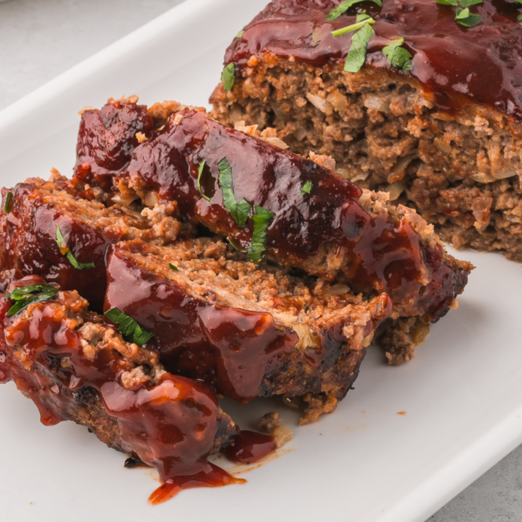 "Golden Corral-inspired meatloaf served with a savory ketchup glaze on a plate"