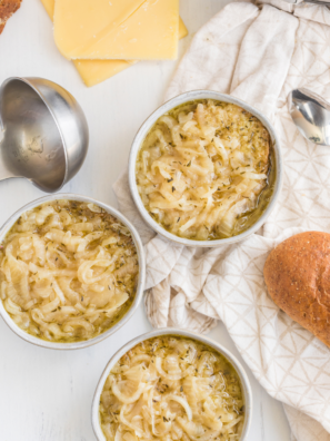 A bowl of Longhorn-style French Onion Soup with melted cheese and crispy toasted bread.