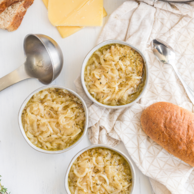 A bowl of Longhorn-style French Onion Soup with melted cheese and crispy toasted bread.