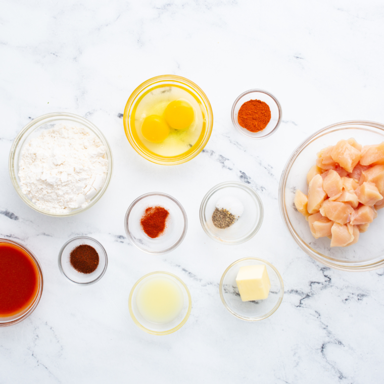 Ingredients needed for Longhorn Spicy Chicken Bites Recipe on kitchen table.