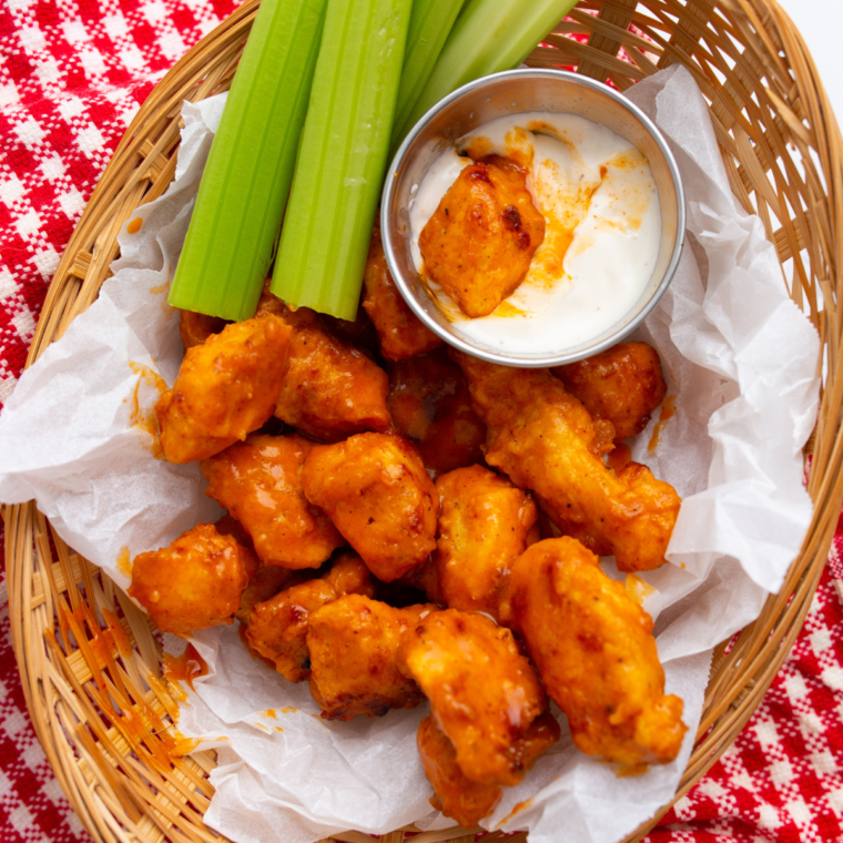 "Close-up of crispy Longhorn Spicy Chicken Bites served with dipping sauce"