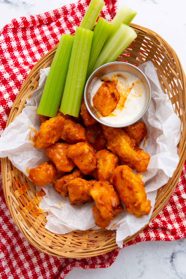 "Plate of crispy Longhorn Spicy Chicken Bites with a side of dipping sauce"