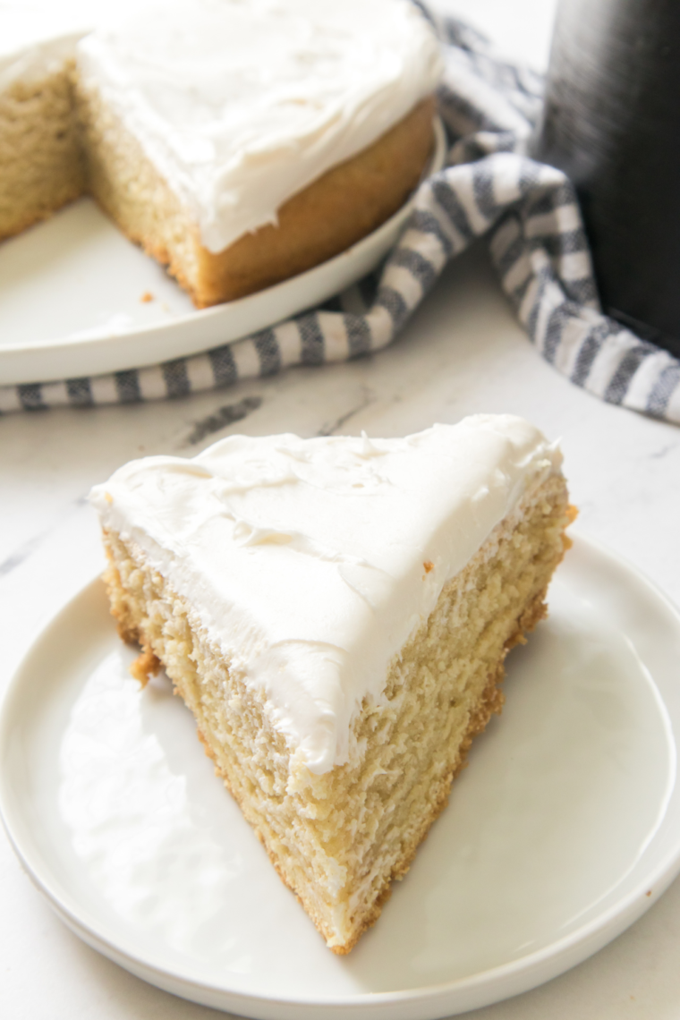 Maggiano’s Butter Cake on a plate with a fork, showcasing its light and fluffy texture.