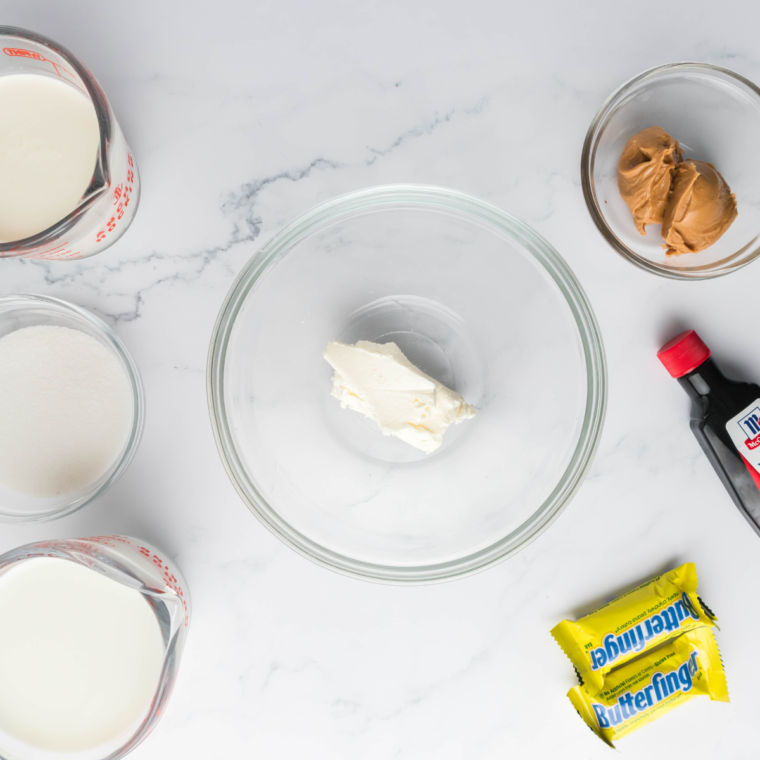 Ingredients needed for Ninja Creami Copycat Dairy Queen Butterfinger Blizzard on kitchen table.