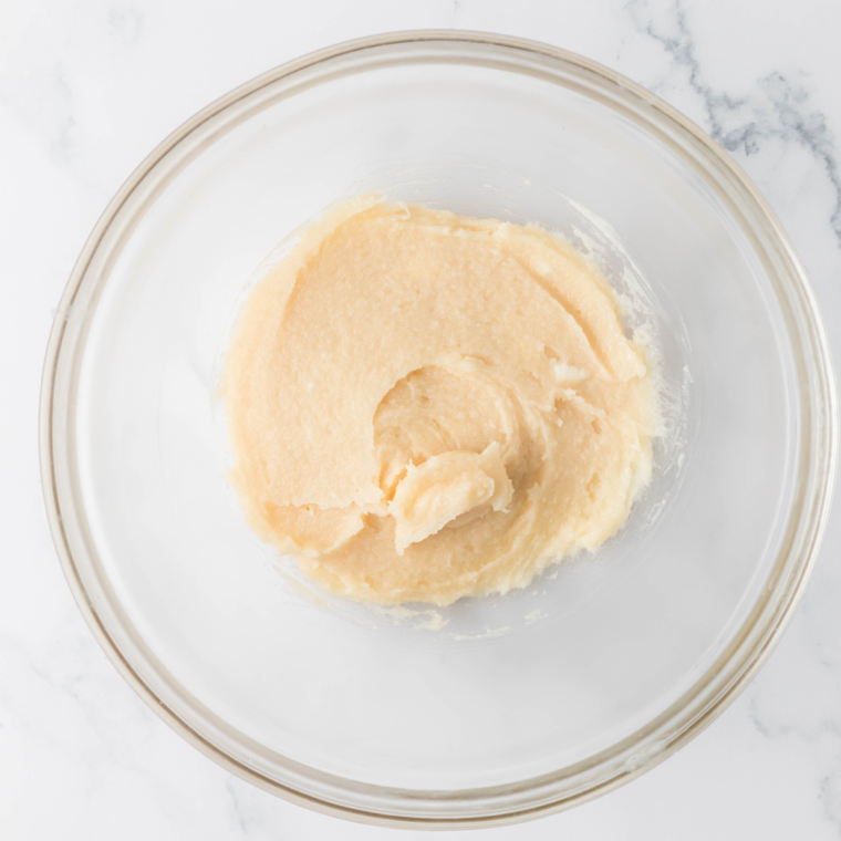 Incorporating softened cream cheese into the ice cream base