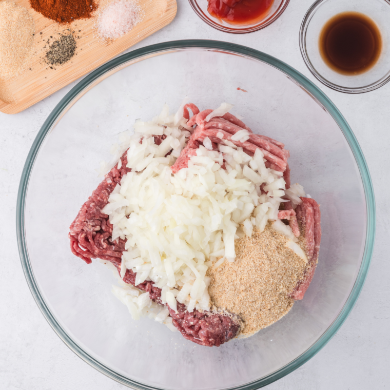 Mixing ground beef and pork for Outback Steakhouse Spicy Jammin' Meatloaf.