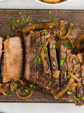 "Tender slow-cooked flank steak served with savory seasonings."