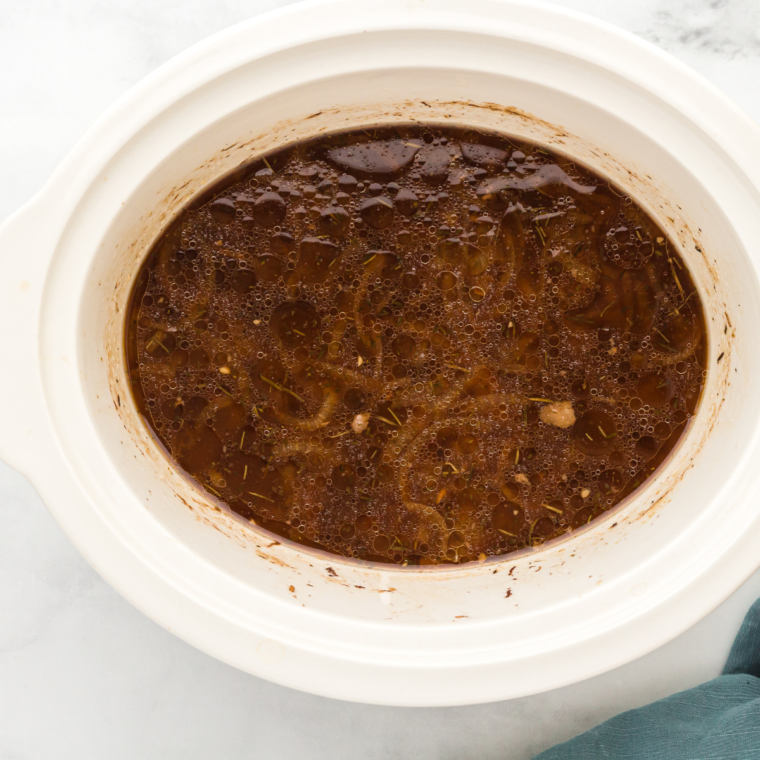 Add all of the ingredients needed for Slow Cooker Flank Steak on the bottom of the crockpot.