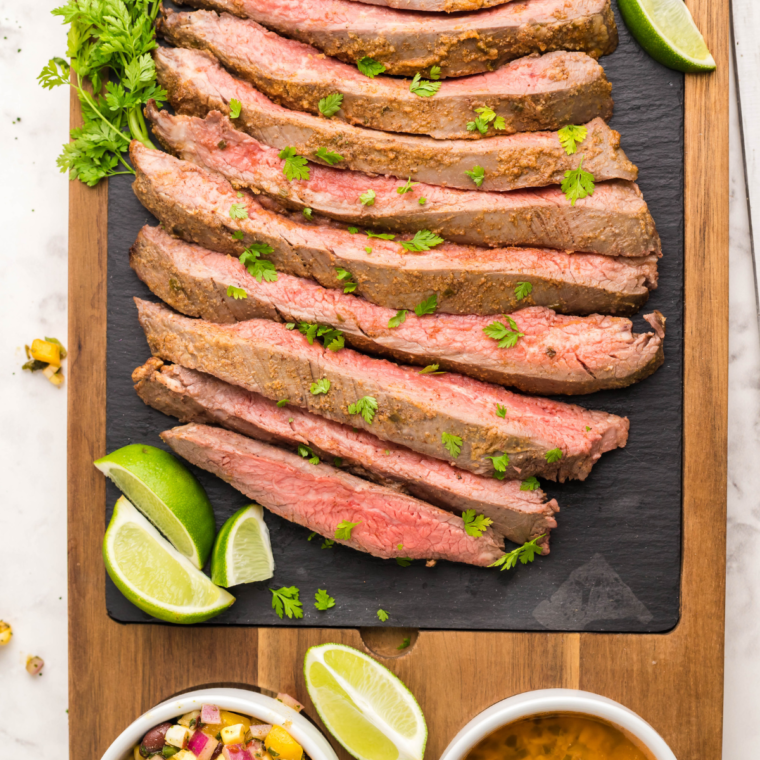 "Slow Cooker Flank Steak with caramelized onions and rich broth."