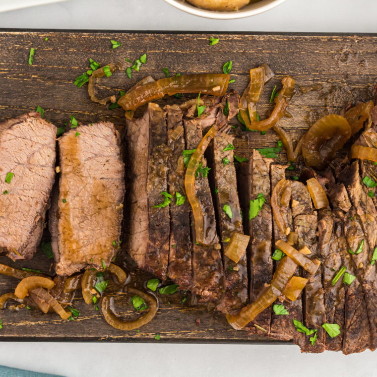 "Tender slow-cooked flank steak served with savory seasonings."